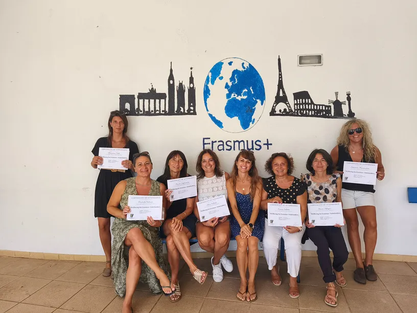Course group holding their certificates of attendance