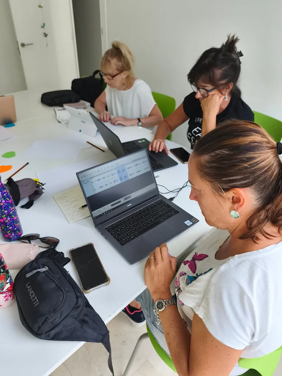 A participant editing audio on a laptop