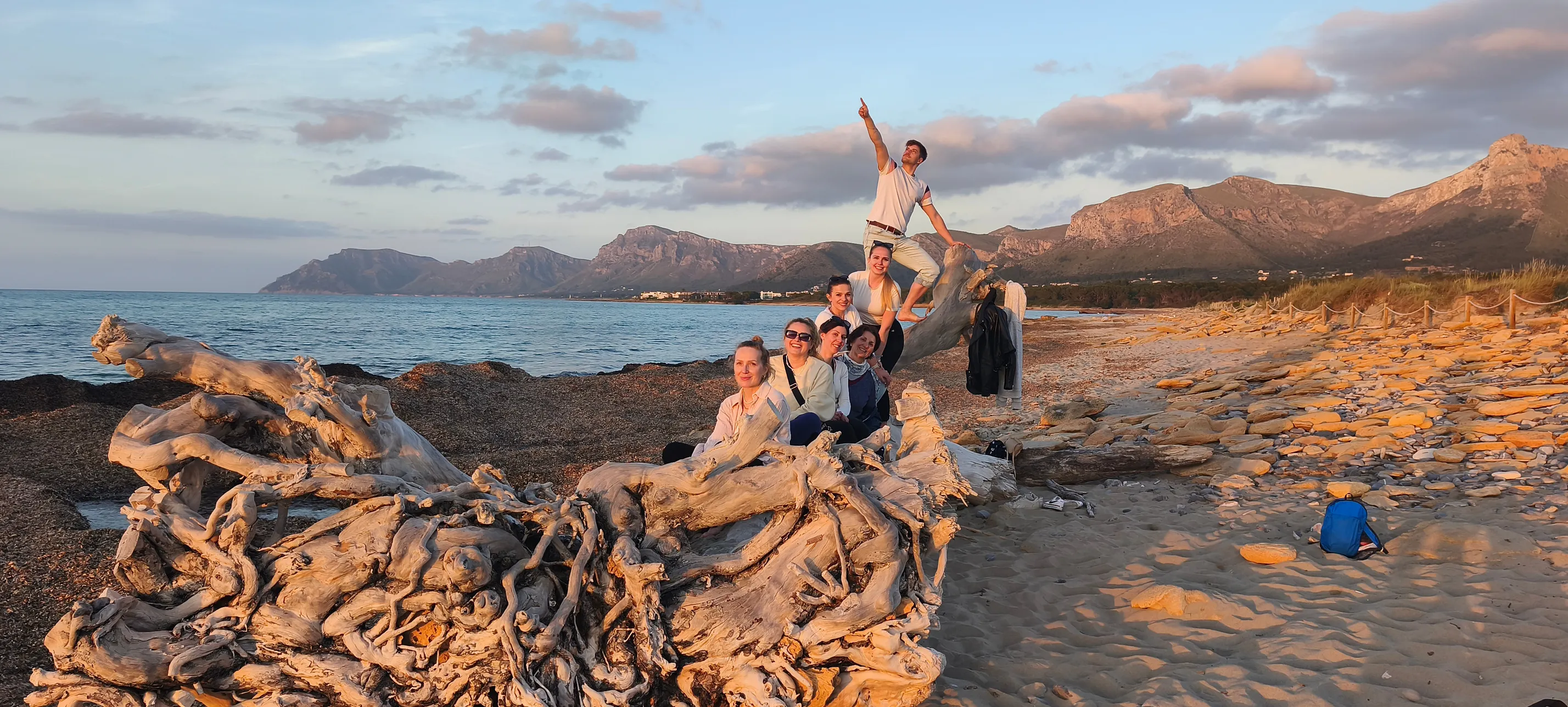 Group watching the sunset from the beach during a mindfulness walk